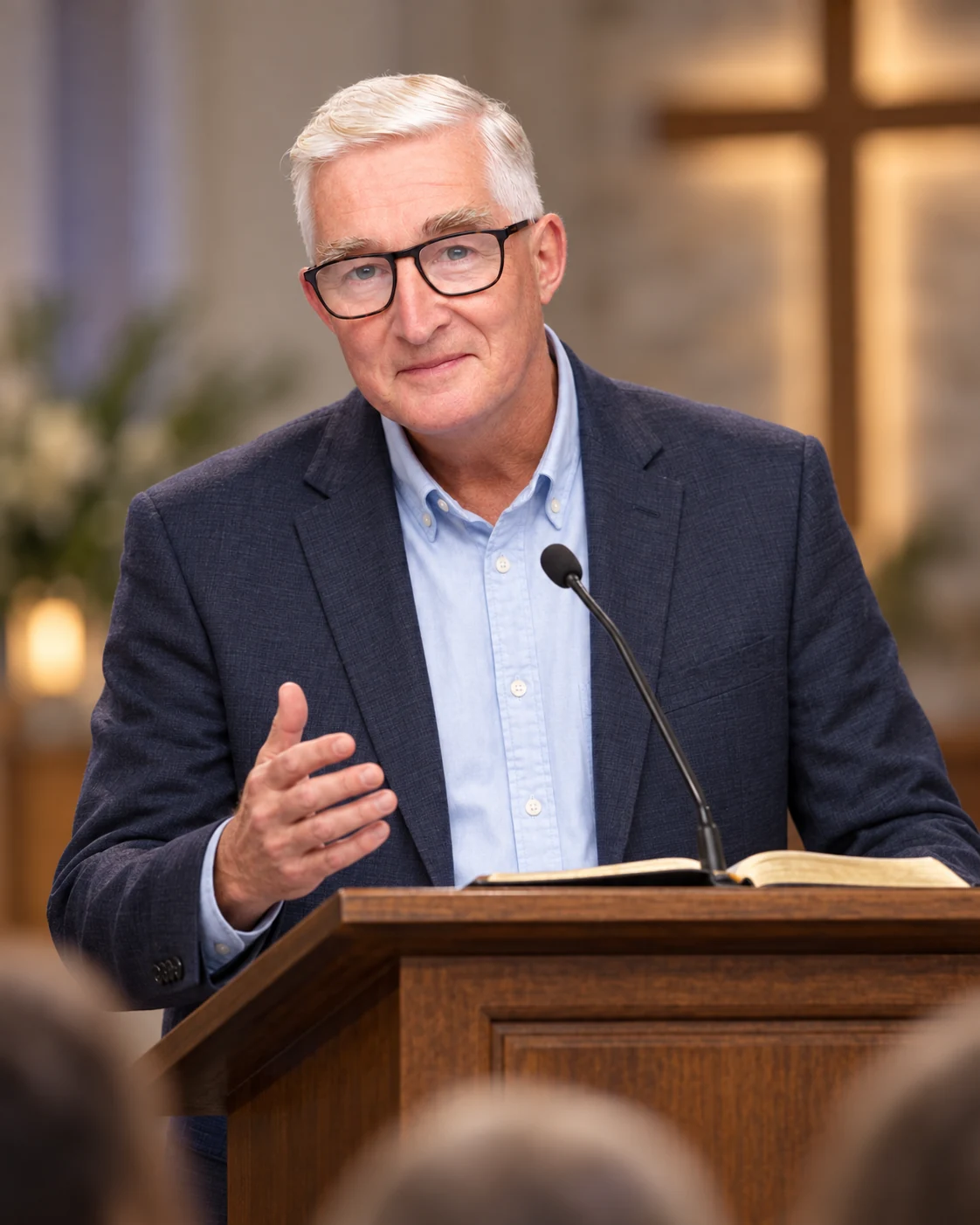 Benjamin Cohen speaking from a pulpit in a church setting